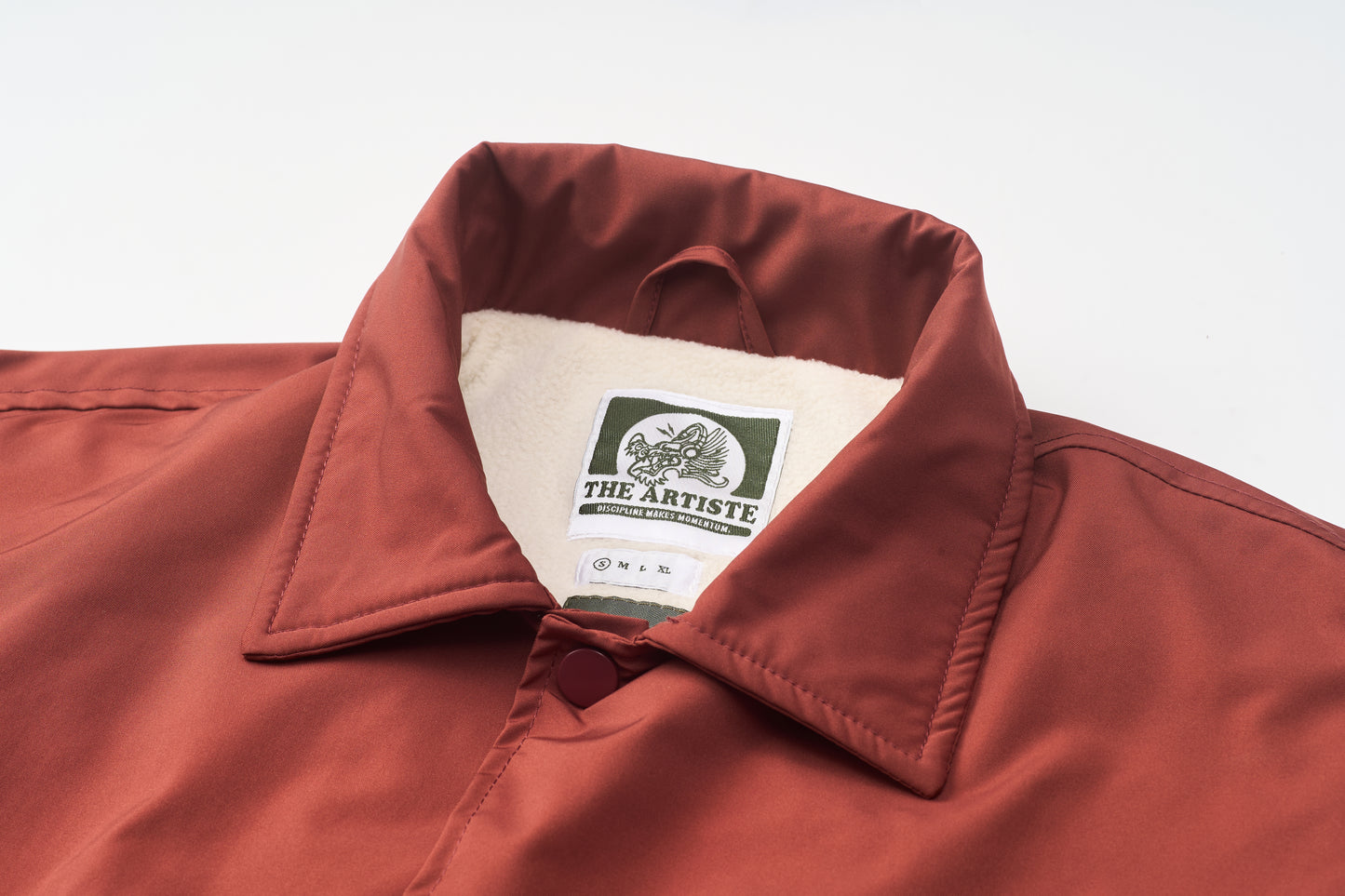 A Classic Coach Jacket Reframed Through THE ARTISTE Lens - RED