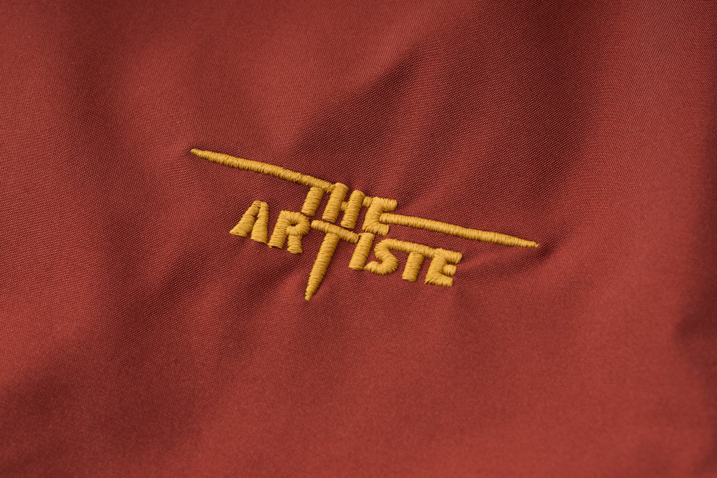 A Classic Coach Jacket Reframed Through THE ARTISTE Lens - RED