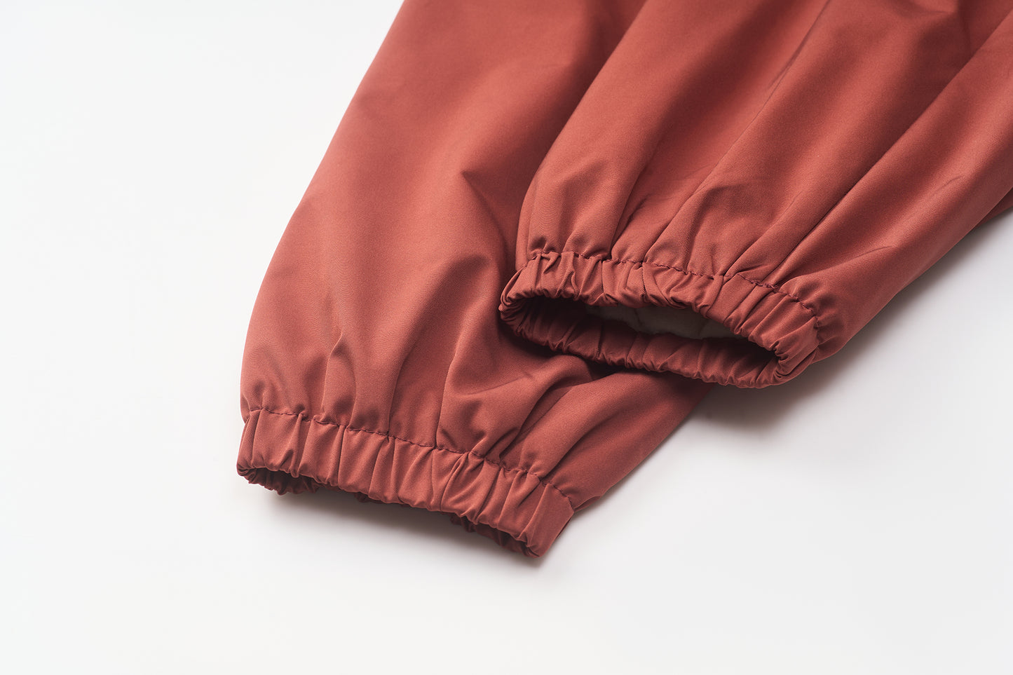 A Classic Coach Jacket Reframed Through THE ARTISTE Lens - RED